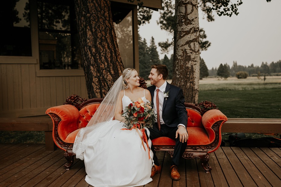 cute bride and groom photo on vintage couch