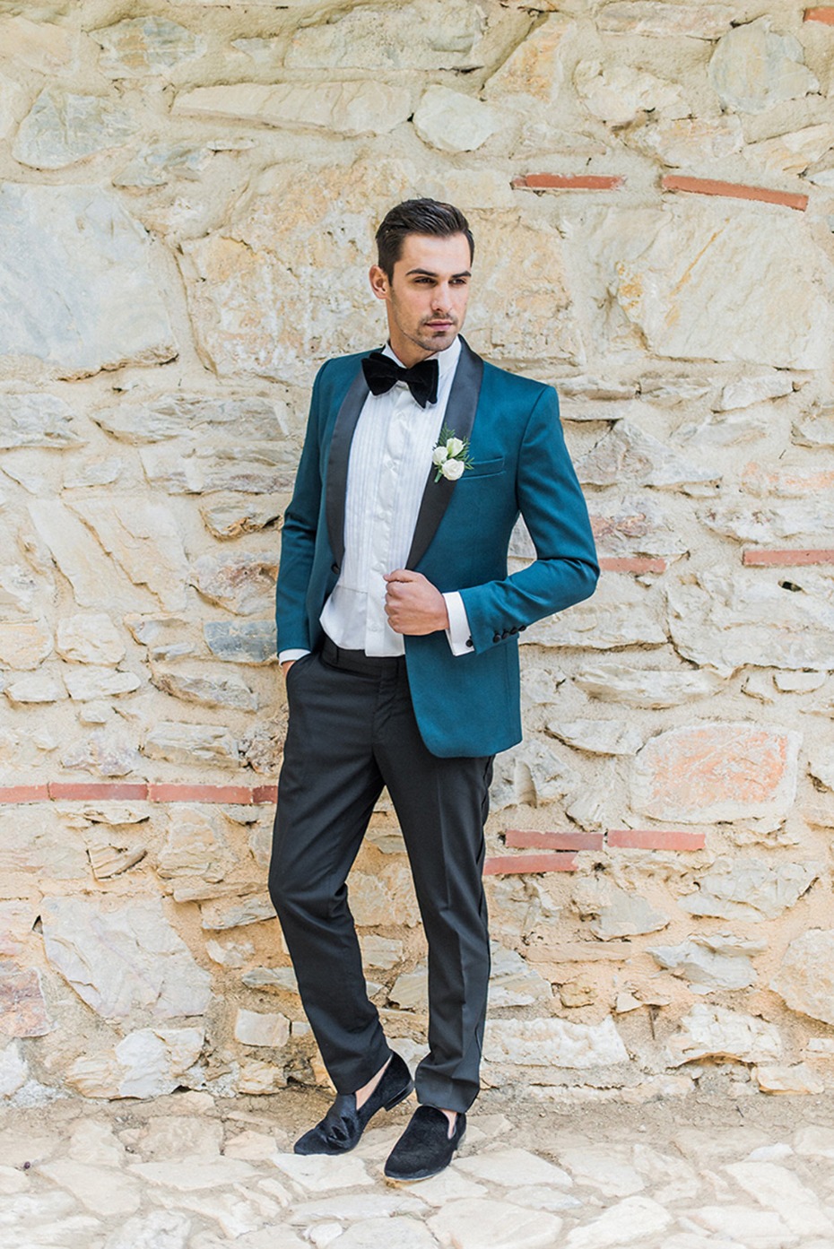 groom in emerald green and black for his late fall wedding