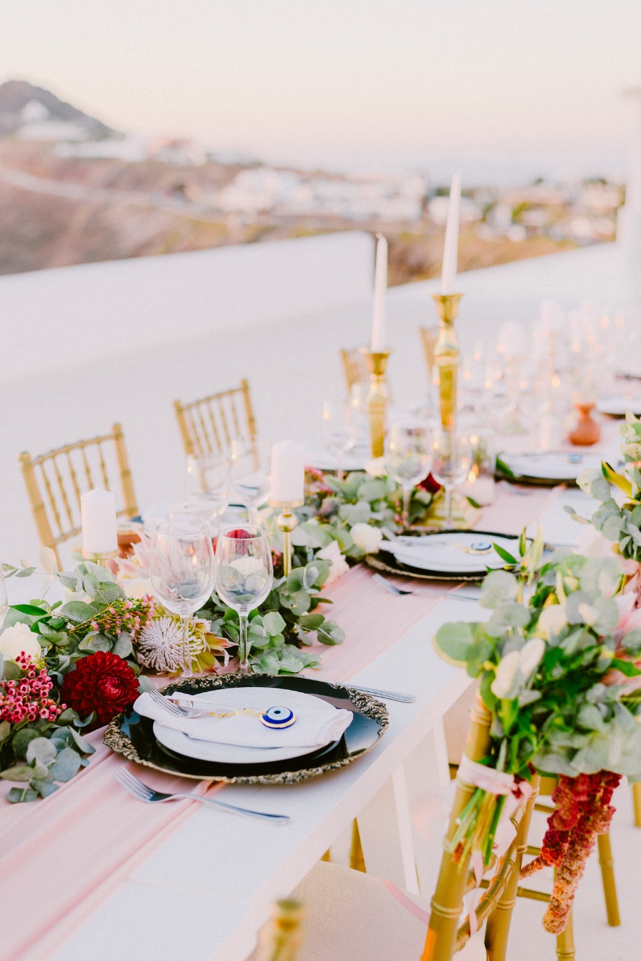 family style wedding seating with gold and pink decor