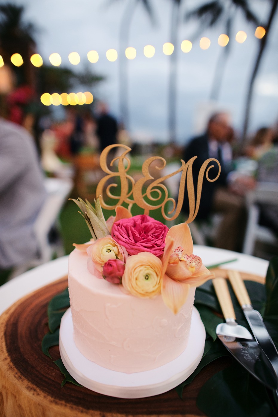 tropical flower topped wedding cake