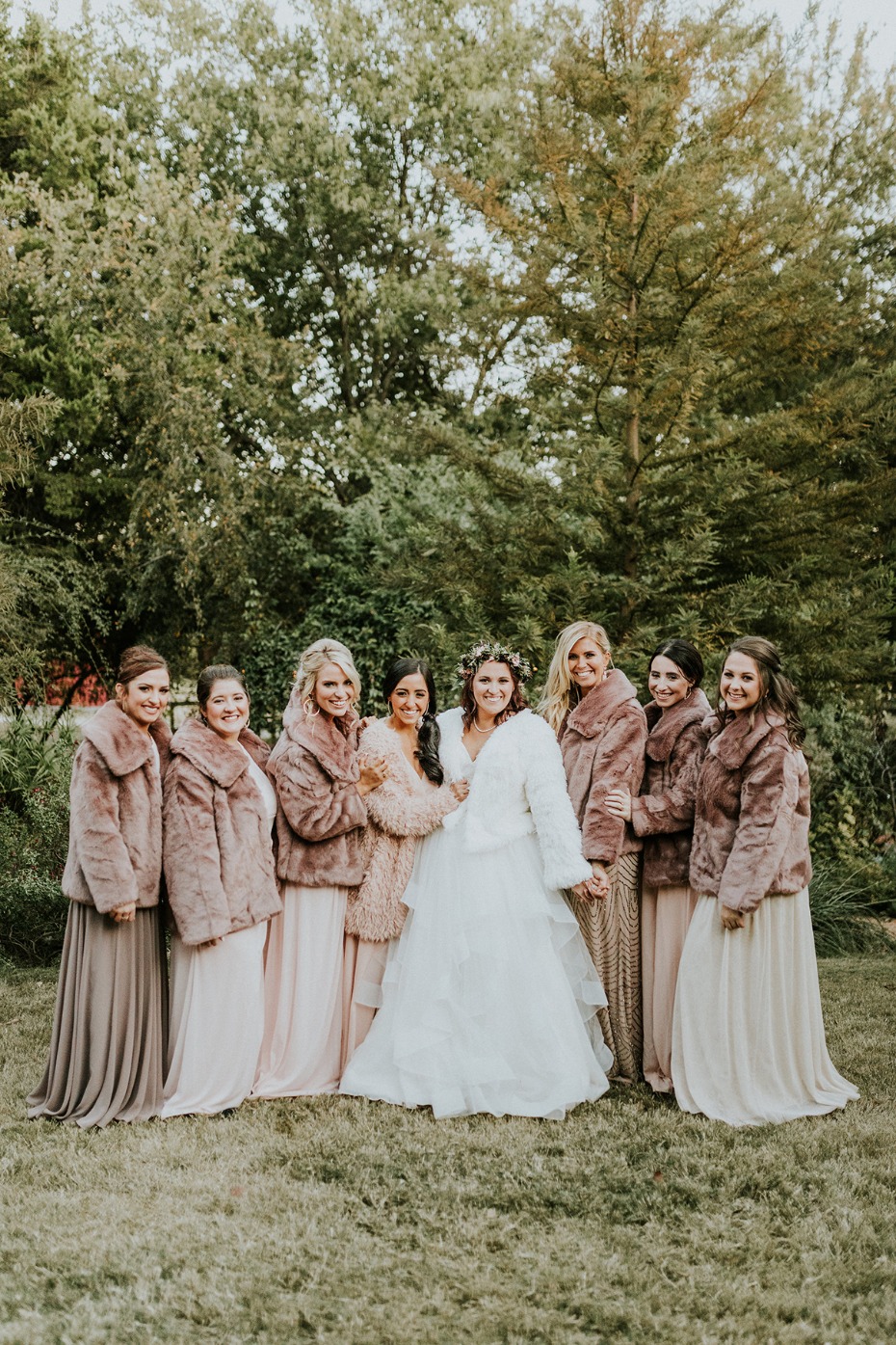 bride and her bridesmaids in cozy fur coats
