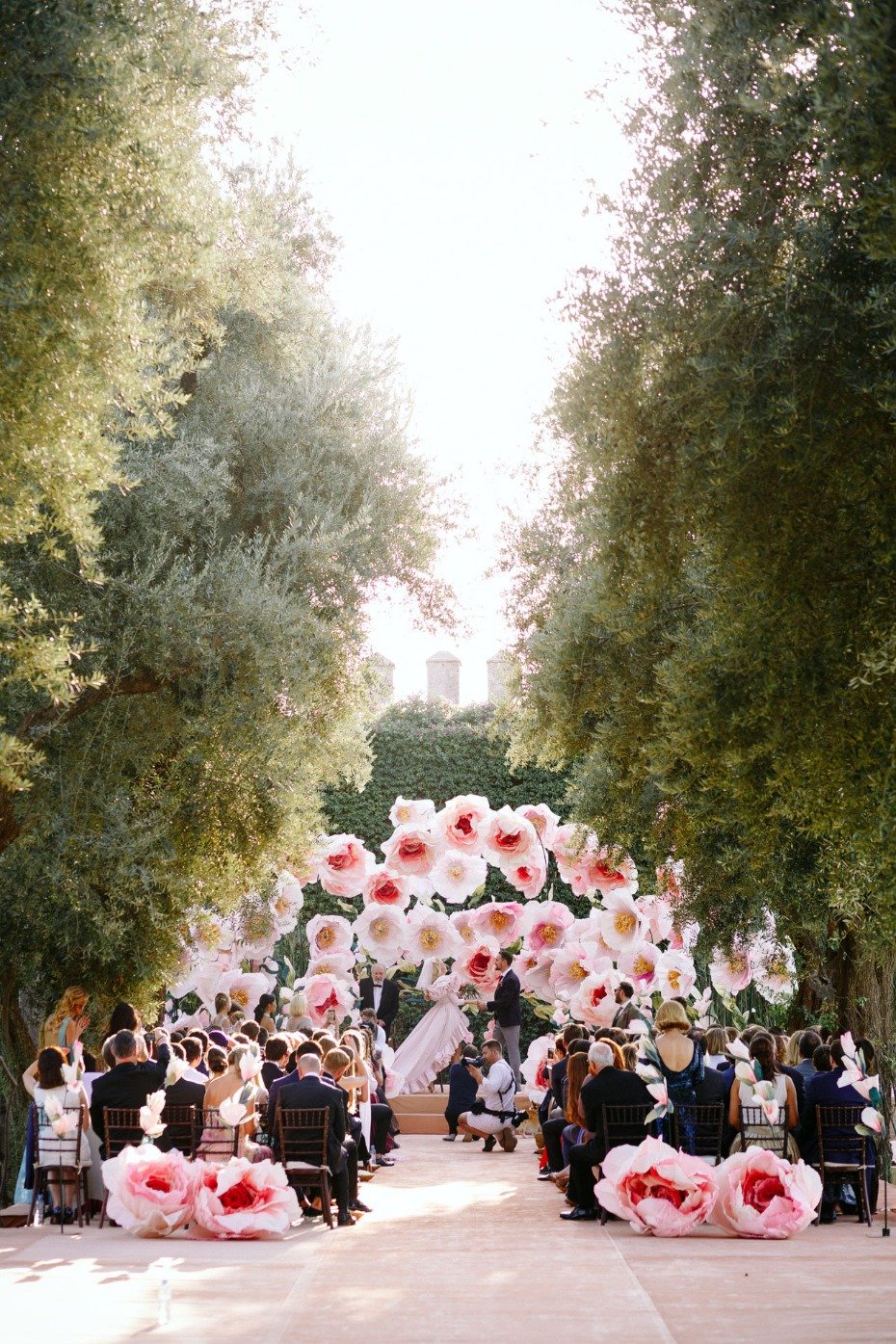 wedding ceremony with giant paper flowers