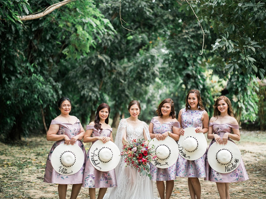 bridesmaids in floral dresses and sun hats