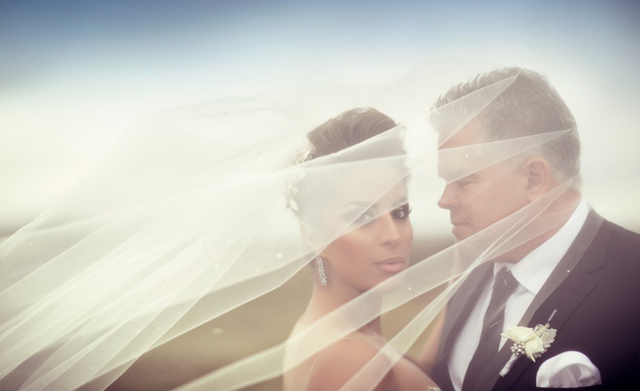 romantic and dramatic wedding portrait of the bride and groom