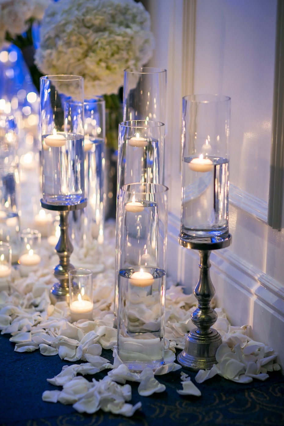 setting the mood with floating candles and oodles of flower petals