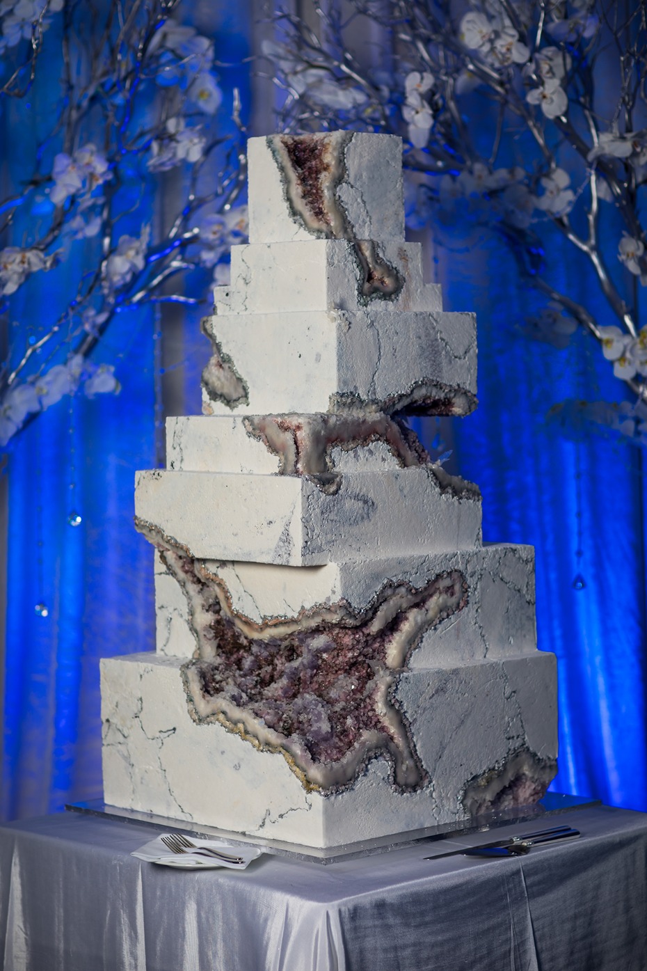 Spectacular tiered wedding cake with geode design and elegant details