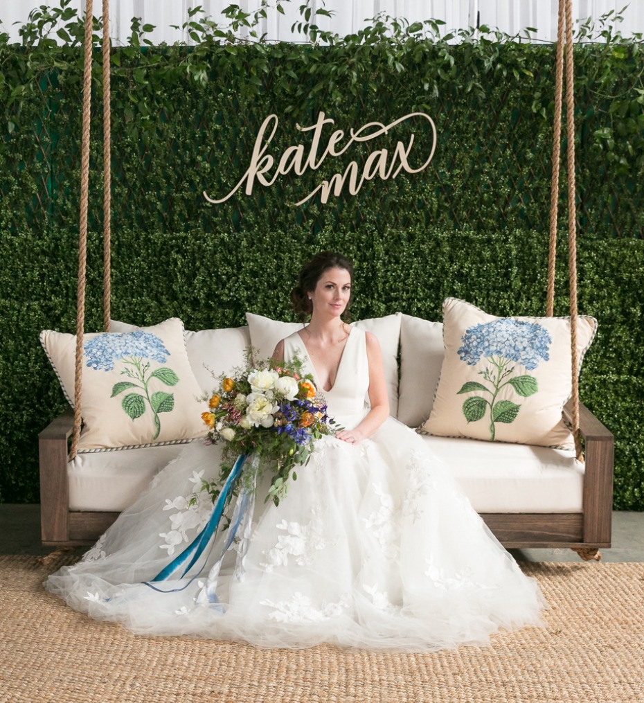 Bride poses on a swing with a beautiful wedding bouquet, Kate Max