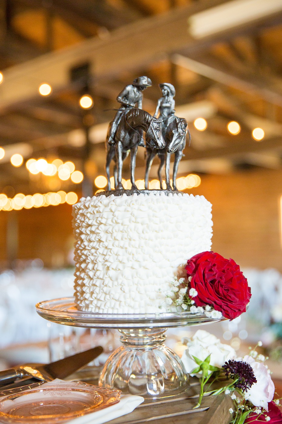 sweet and simple wedding cake with custom cake topper