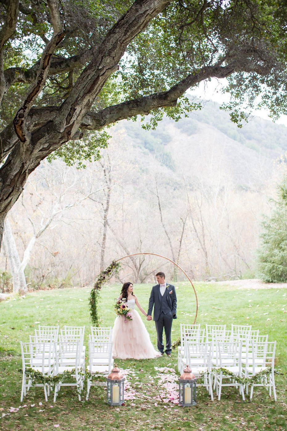Outdoor ceremony with circle arch