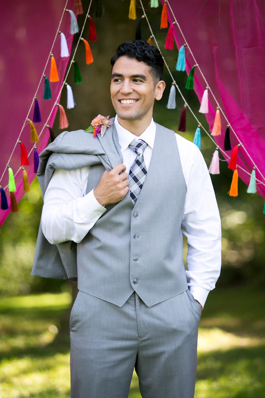 groom in three piece grey suit