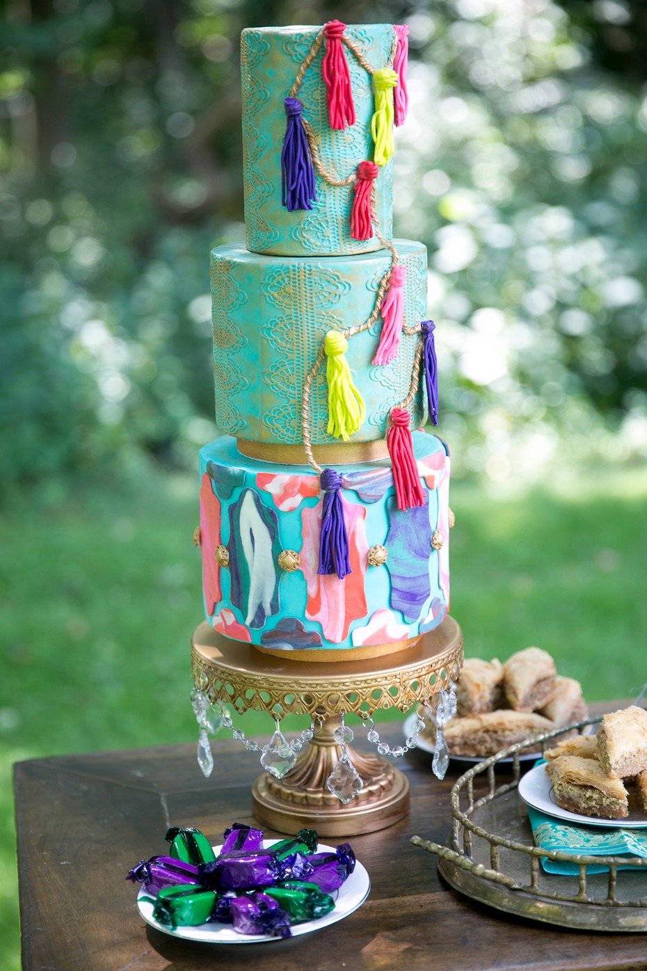 whimsical tassel cake in teal and gold