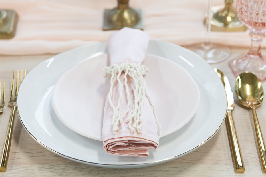 macramÃ© napkin ring and blush and gold place setting