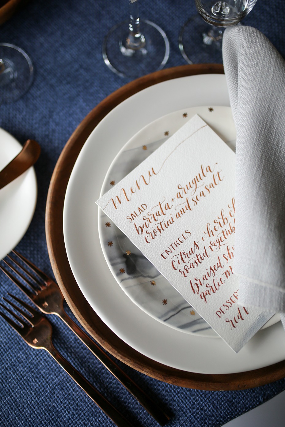 copper and blue winter wedding table setting