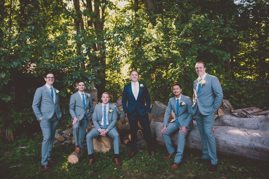 the groom and his groomsmen in grey suits