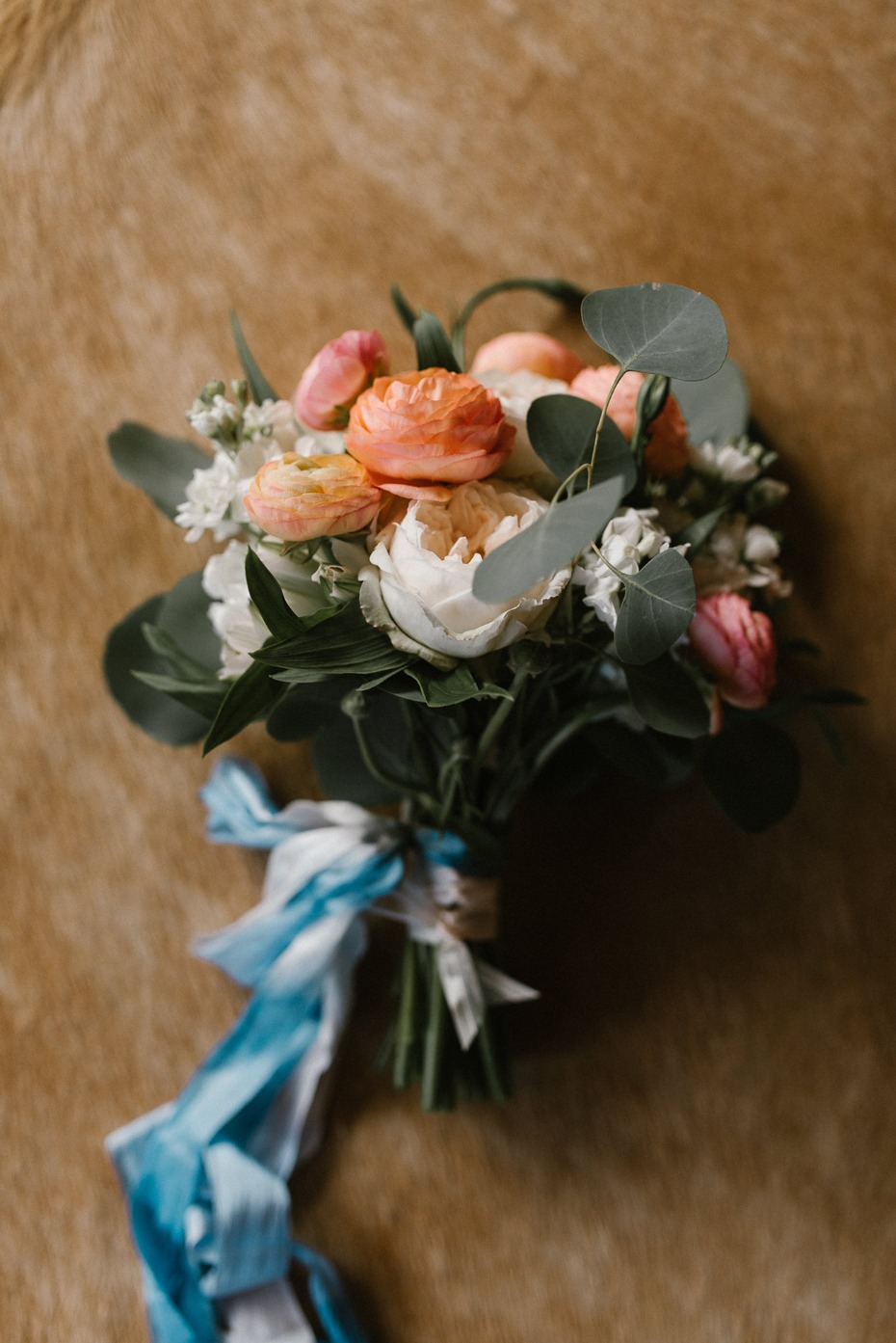 Brides bouquet with blue ribbons