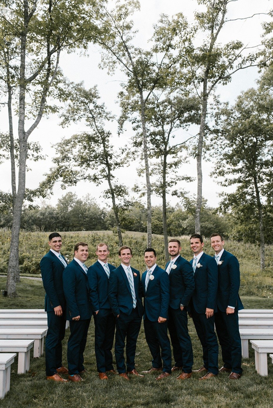Matching groomsmen in navy suits