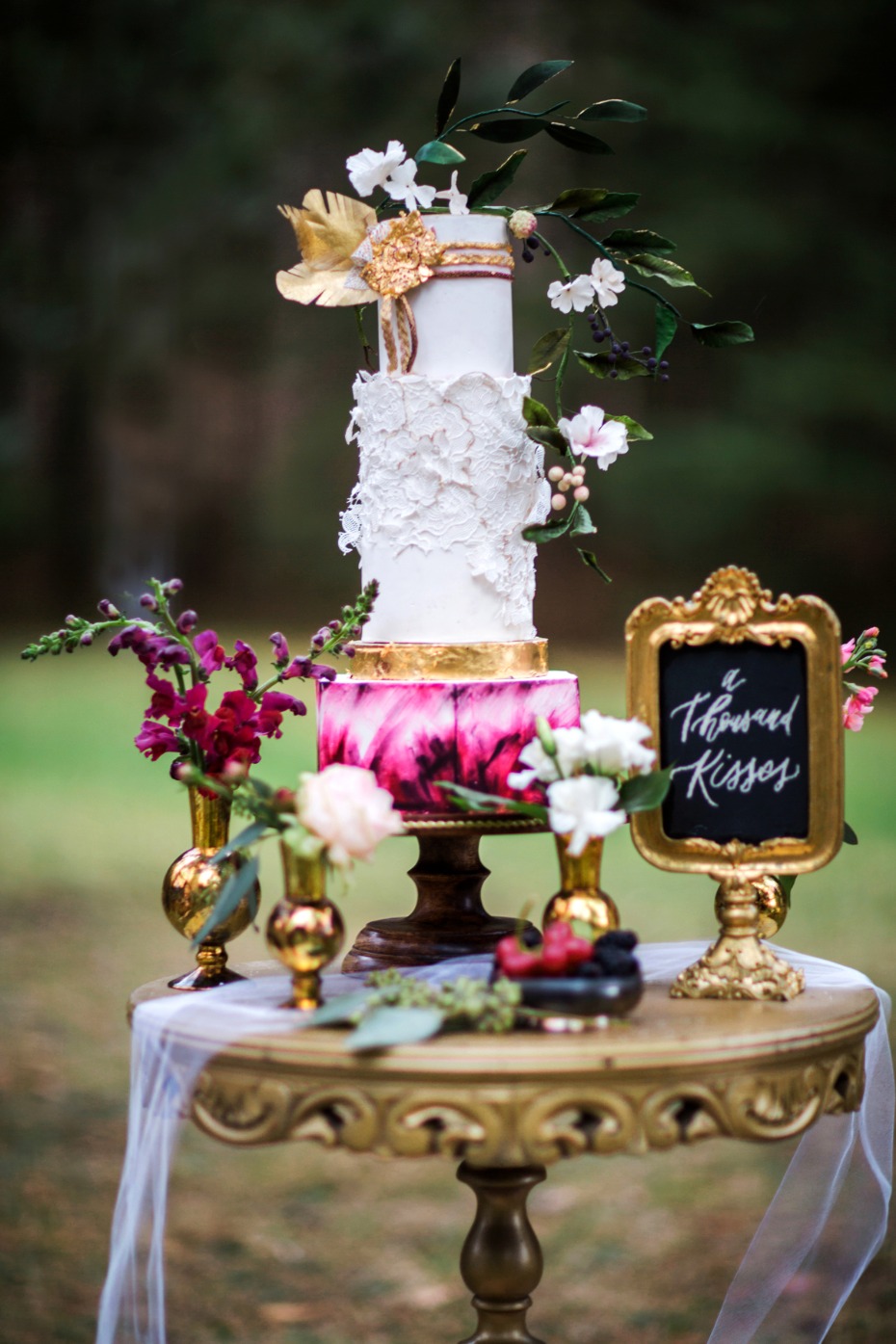 wedding cake with gold leaf accents