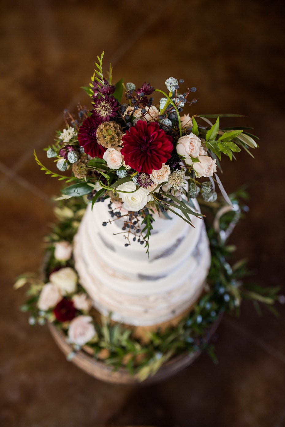 rustic and wild inspired flower topped wedding cake