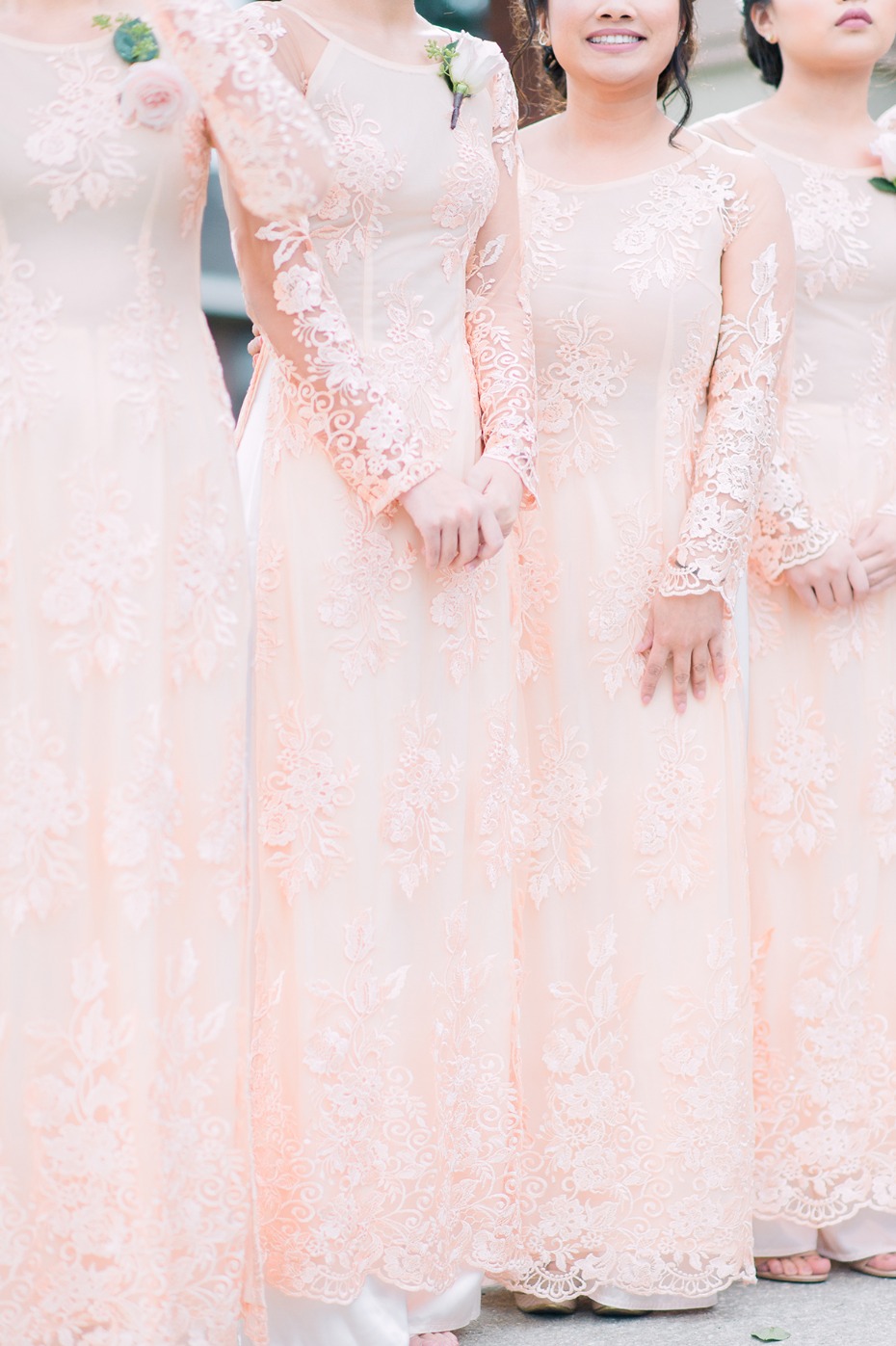 bridesmaids in long sleeve blush dresses
