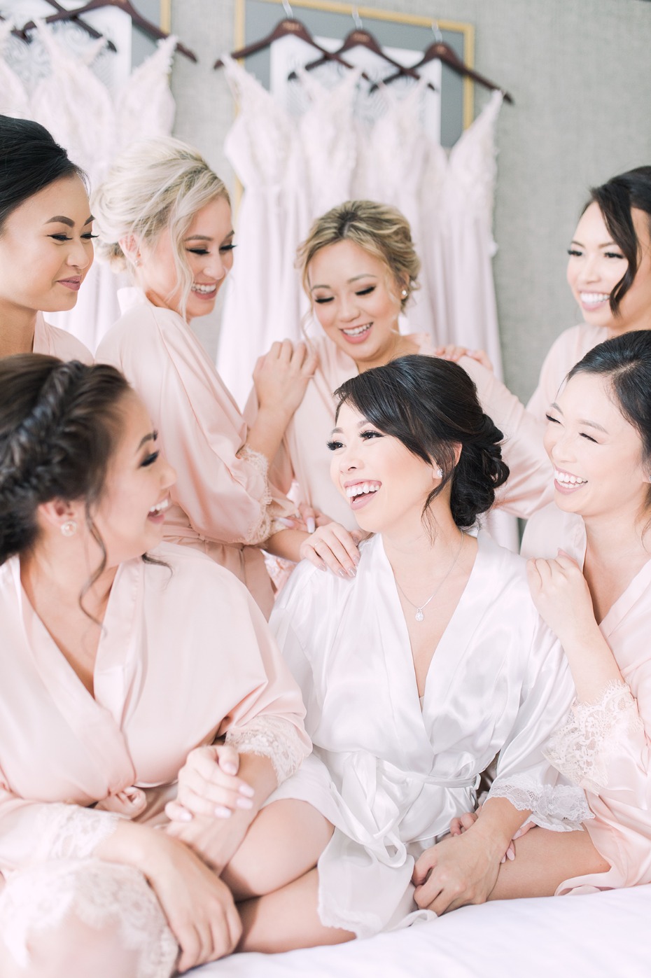 a bride and her bridesmaids getting wedding ready