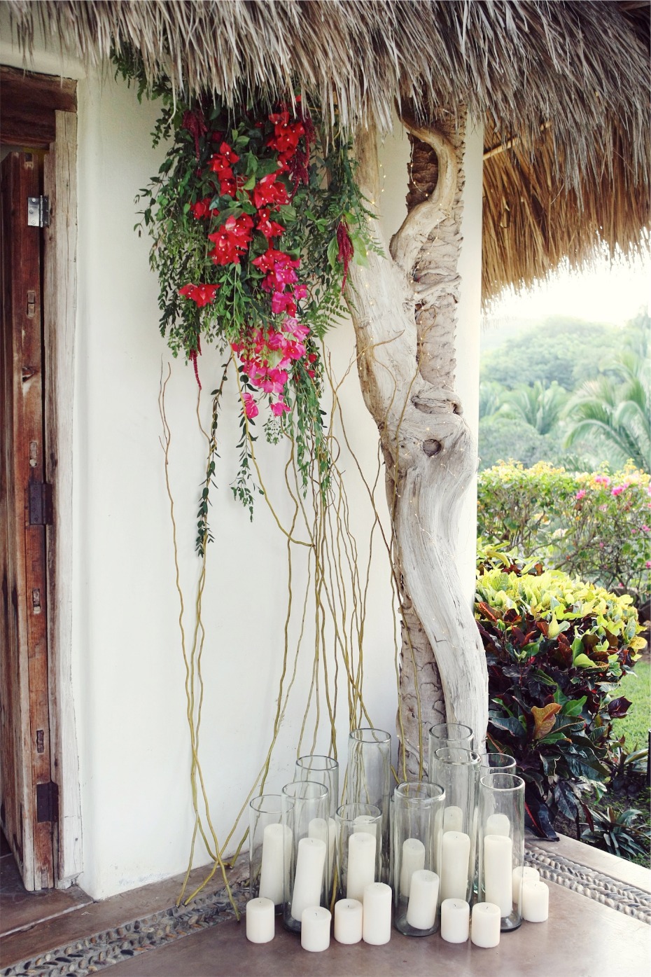hanging tropical florals and pillar candles