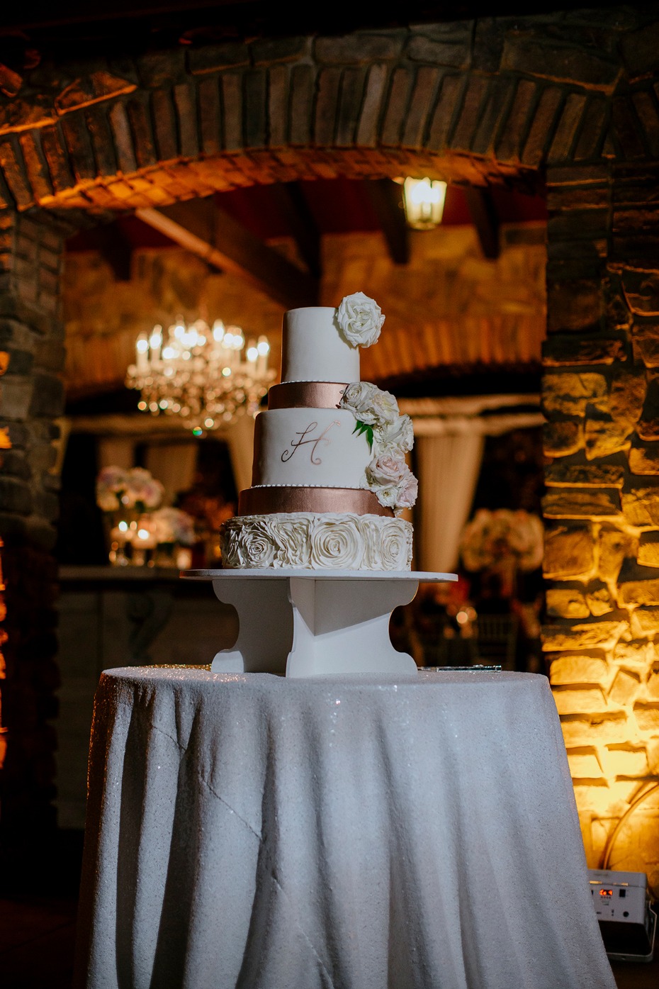 white and copper wedding cake