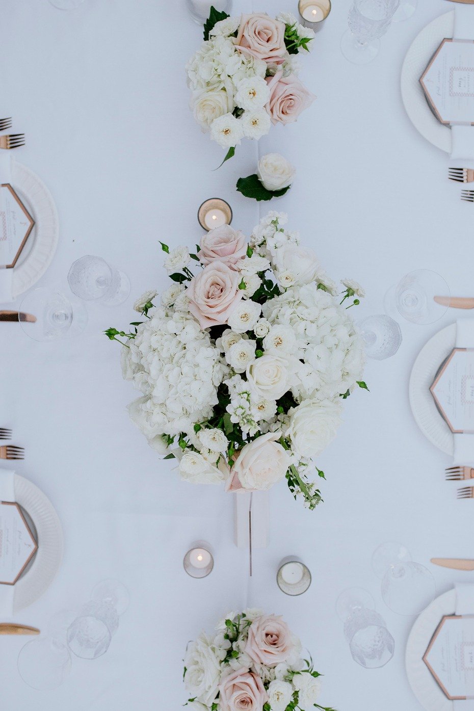 white and blush wedding centerpiece