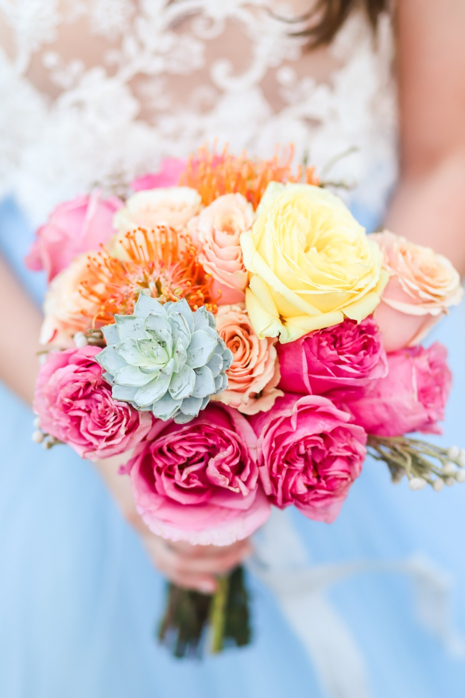 Vibrant bridal bouquet with roses and other colorful flowers