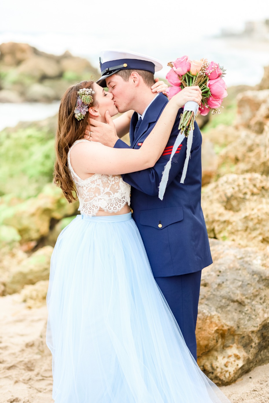 Bride and groom share a kiss during outdoor wedding