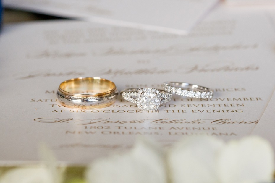 Wedding rings on elegant wedding invitation
