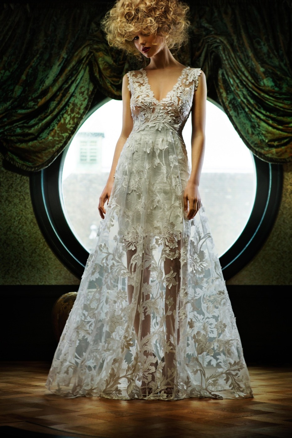 Woman in a stunning sheer floral lace wedding gown