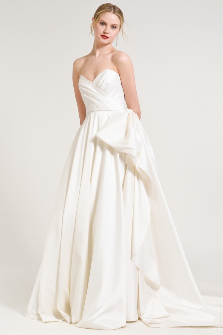Elegant strapless satin wedding gown with draped detail