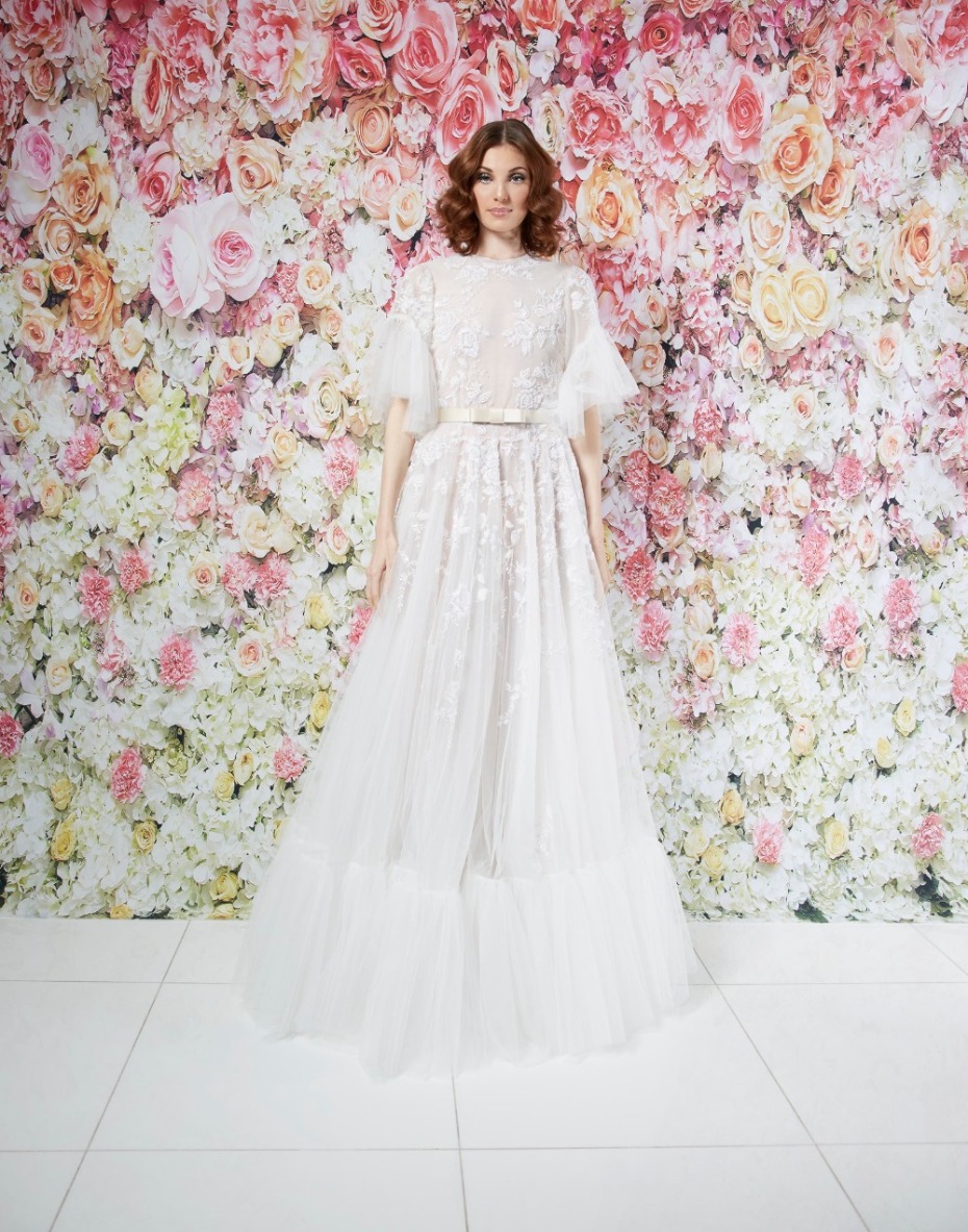 Elegant bride in a floral-embellished wedding gown