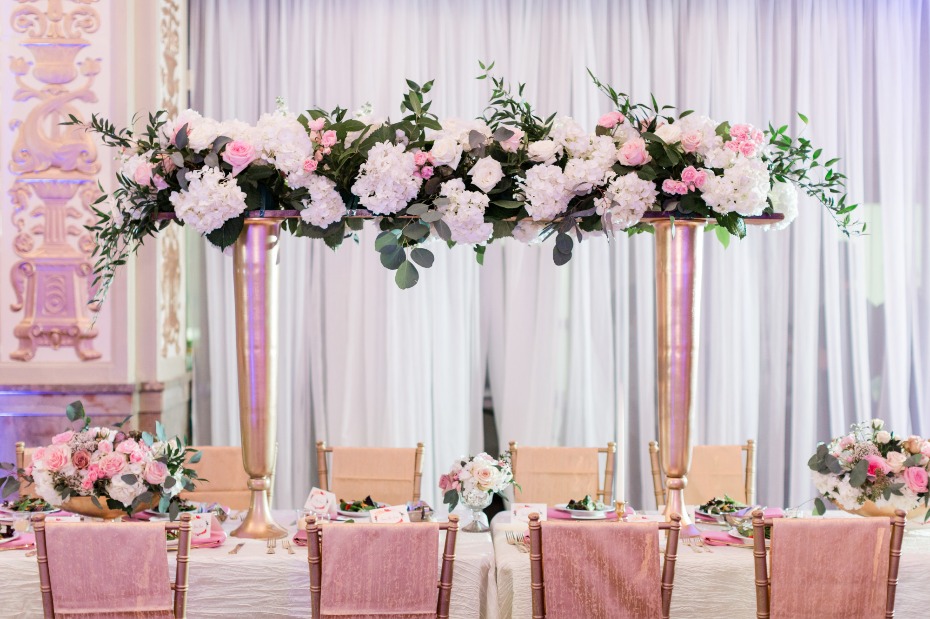 Reception table with floral arbor