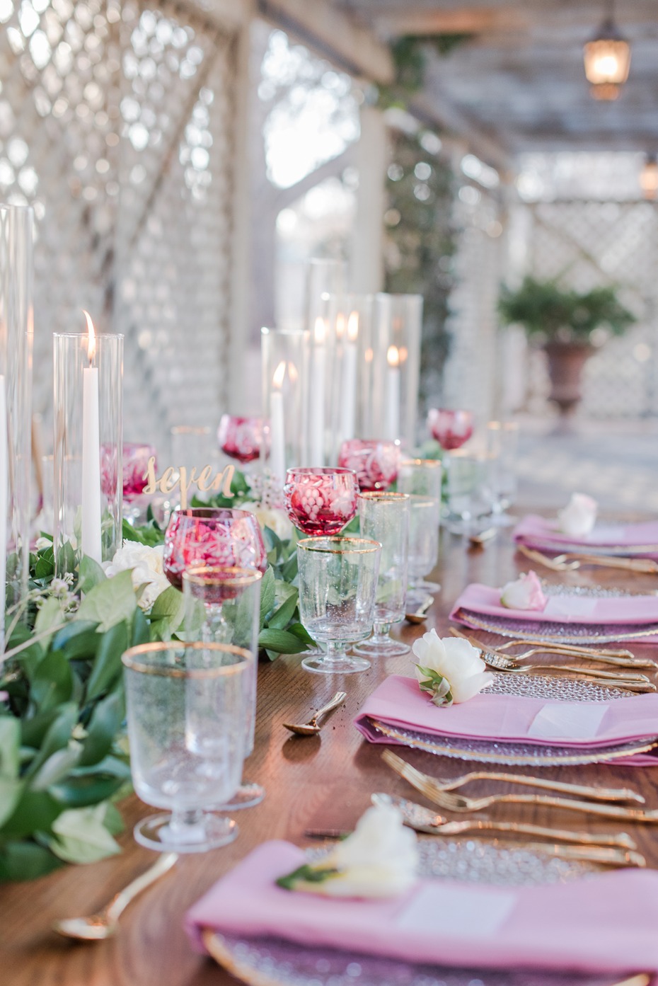 romantic table setting in pink and gold with candles