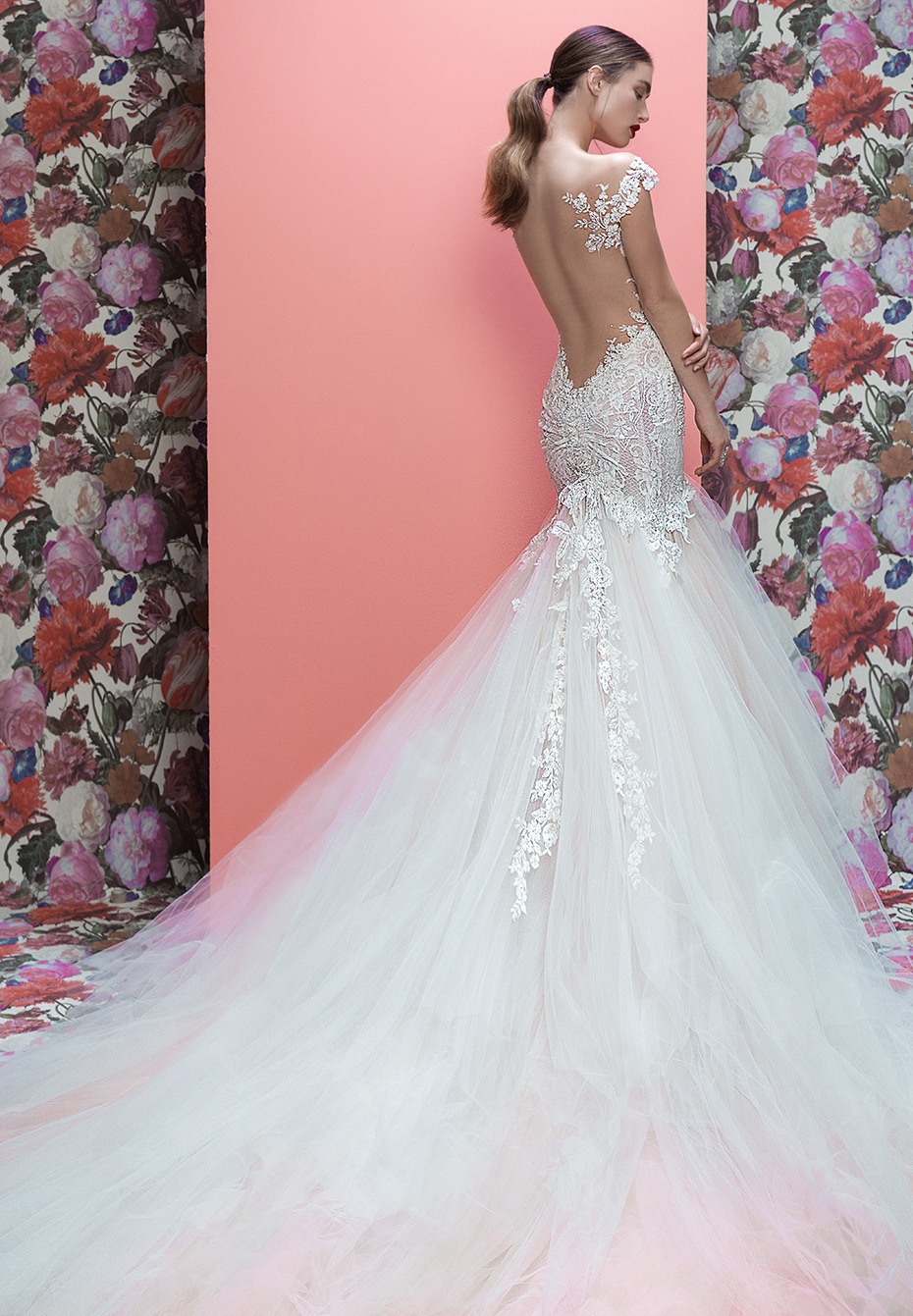 Elegant bride in backless lace and tulle wedding dress