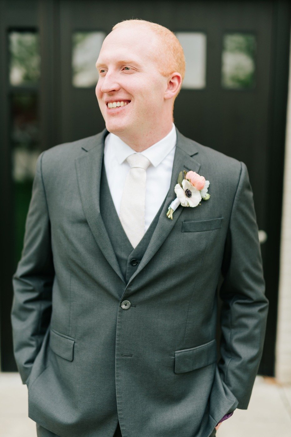 groom in charcoal suit