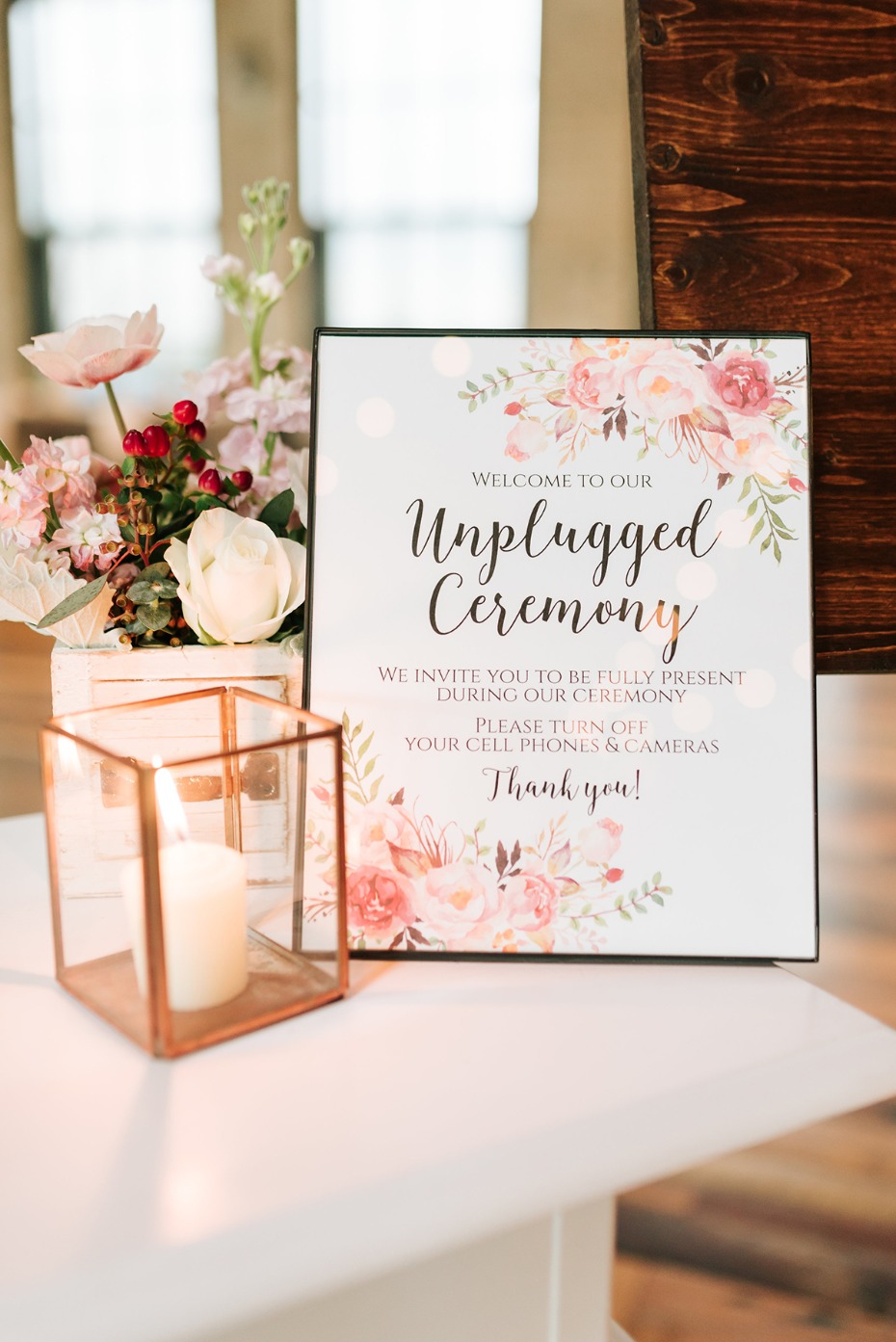 Unplugged Ceremony sign with flowers and candle decor