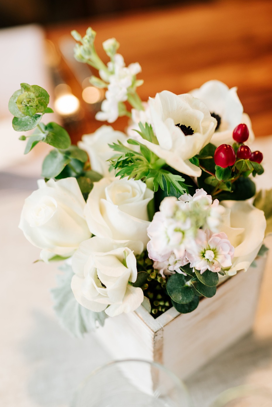 Elegant white flower arrangement in wooden box centerpiece