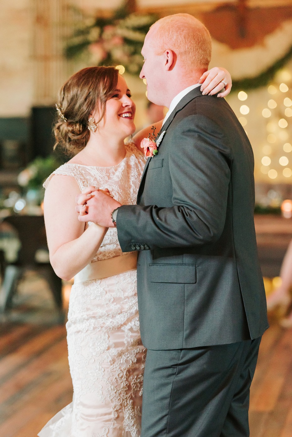 Bride and groom share their first dance at wedding