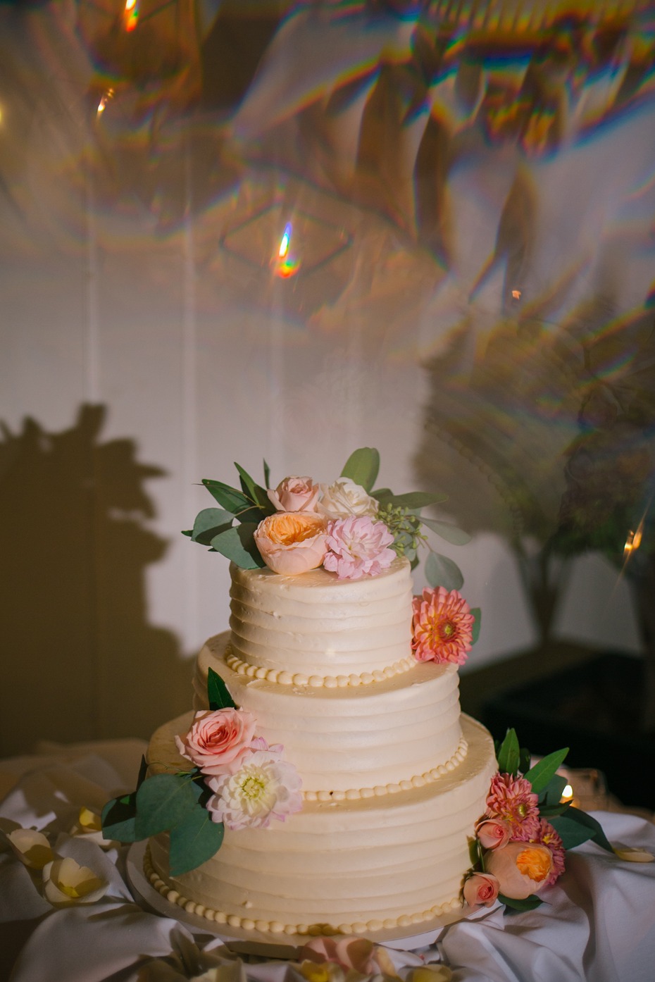 Wedding cake covered in flowers