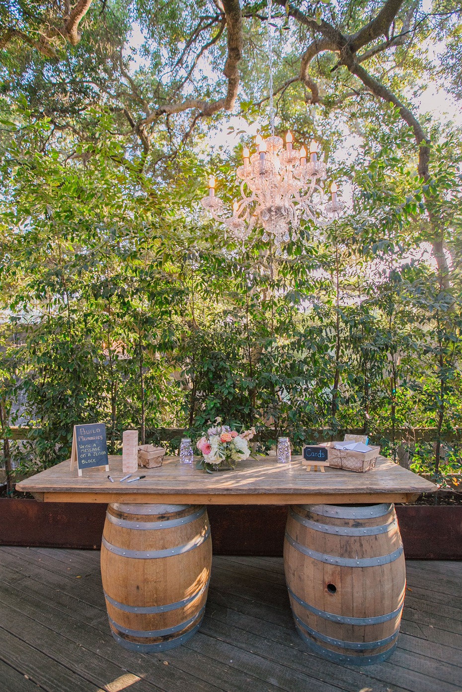 Welcome table with whiskey barrels