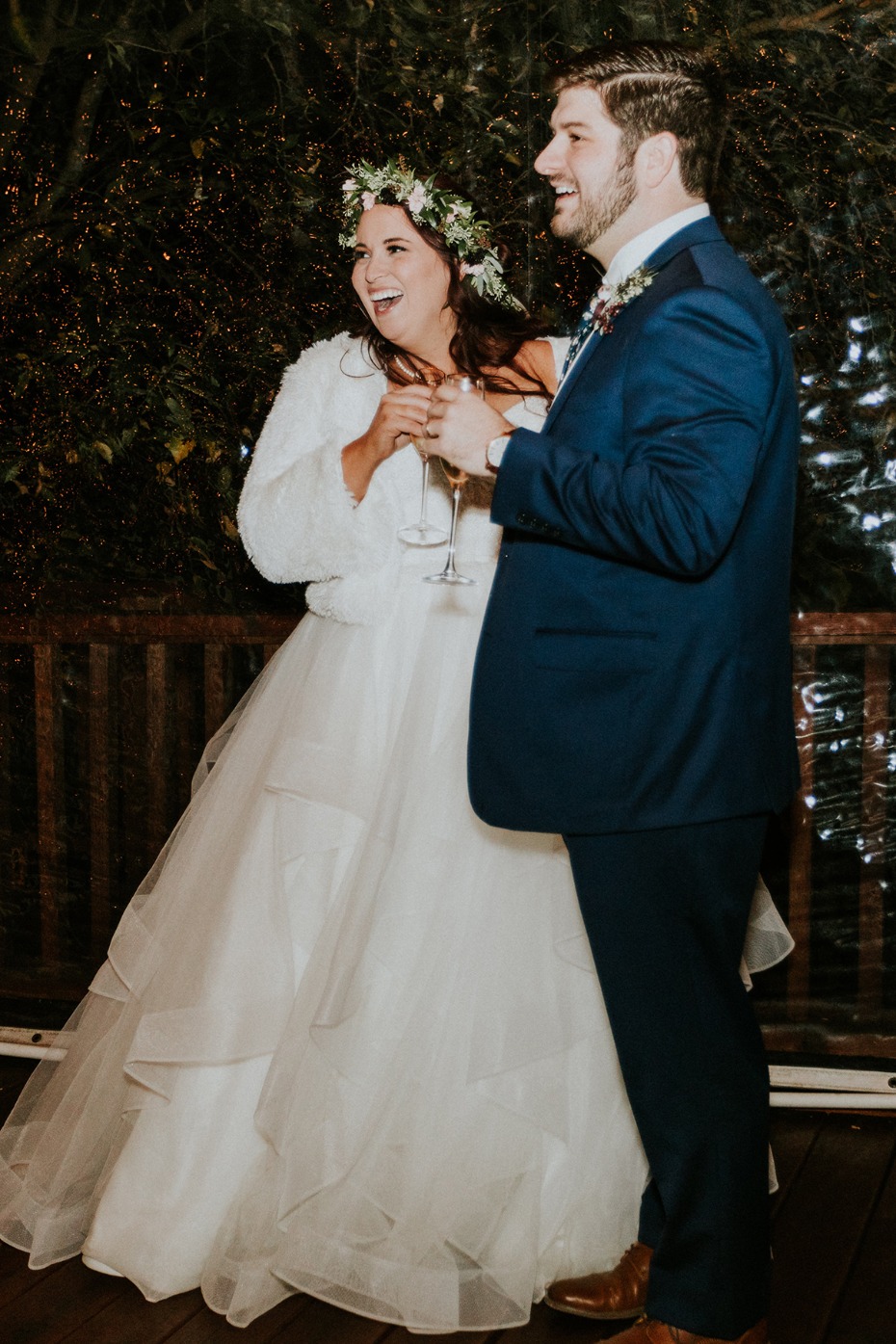 Happy bride and groom toast at wedding reception