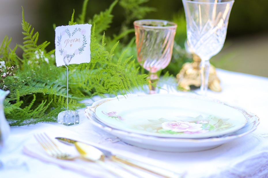 Elegant wedding table setting with groom place card