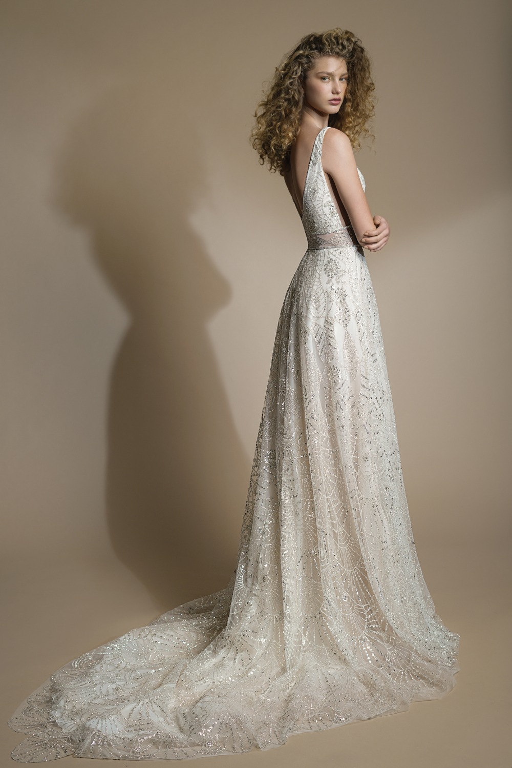 shimmering sequined tulle with a striking Galia Lahav wedding dress with a geometric silver patter over a nude background