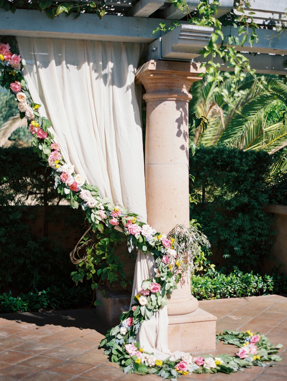 ceremony backdrop curtain with floral garland