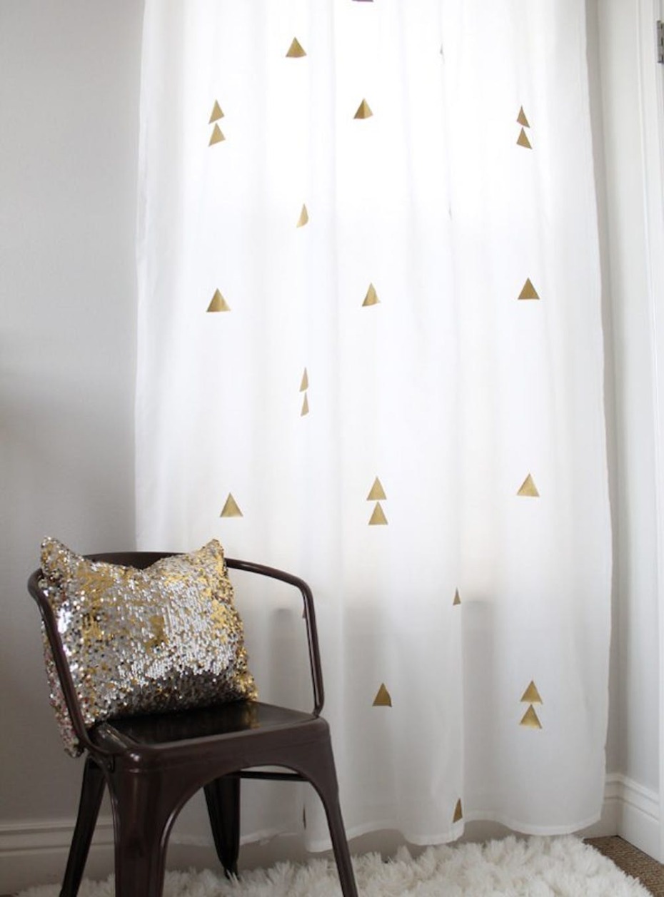 Room decor with chair and curtain with gold triangles