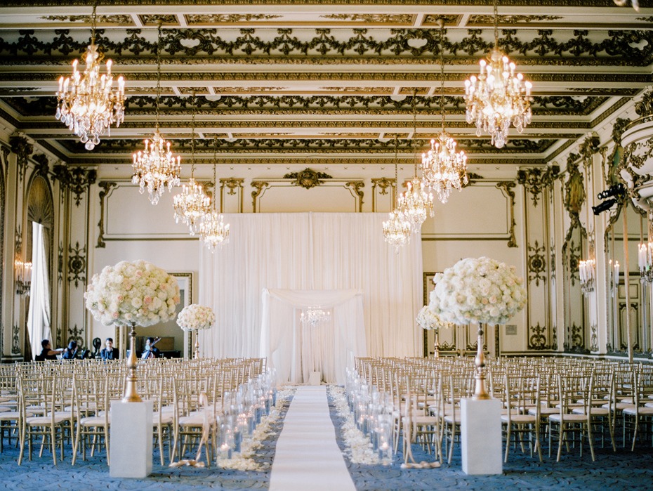 gold room wedding ceremony in glamorous gold and white