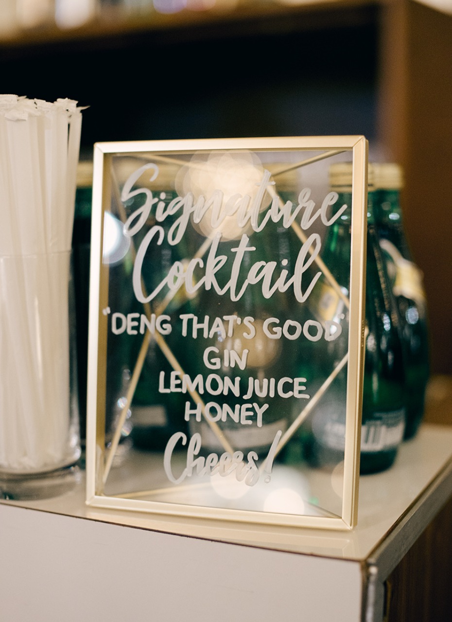 glass and gold framed wedding cocktail sign