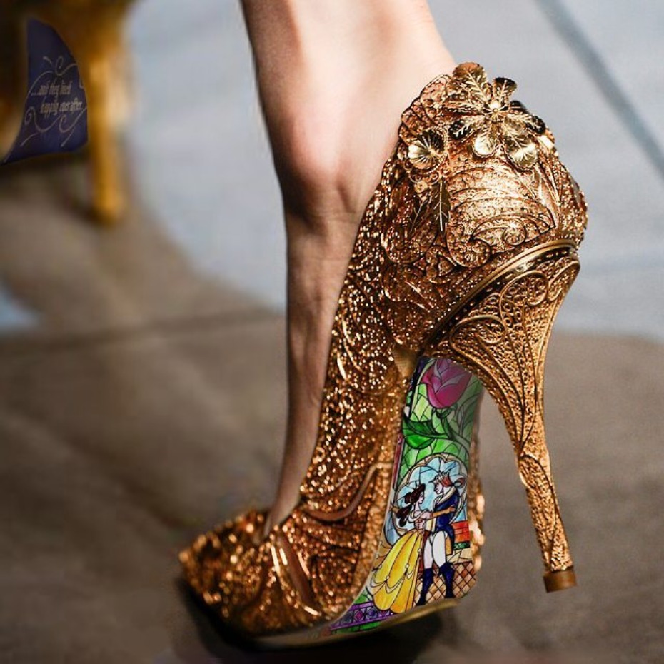gold shoes hand painted with Beauty and The Beast on the back